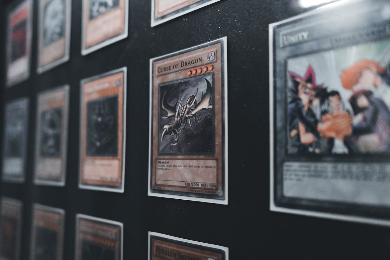 A close-up view of Yu-Gi-Oh! trading cards in a display case showcasing rare and collectible cards.